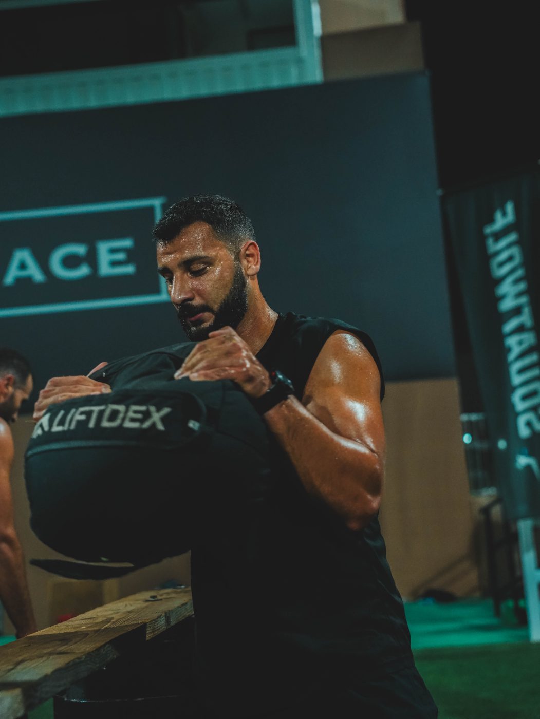 An athlete working through a station at a Primal race