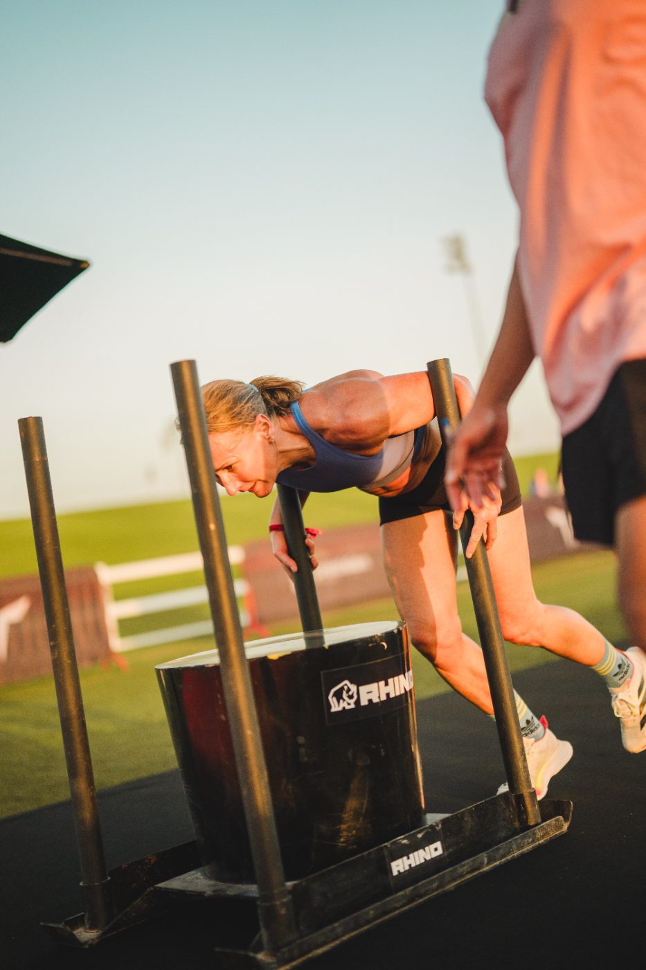 An athlete pushing the sled at a Primal race